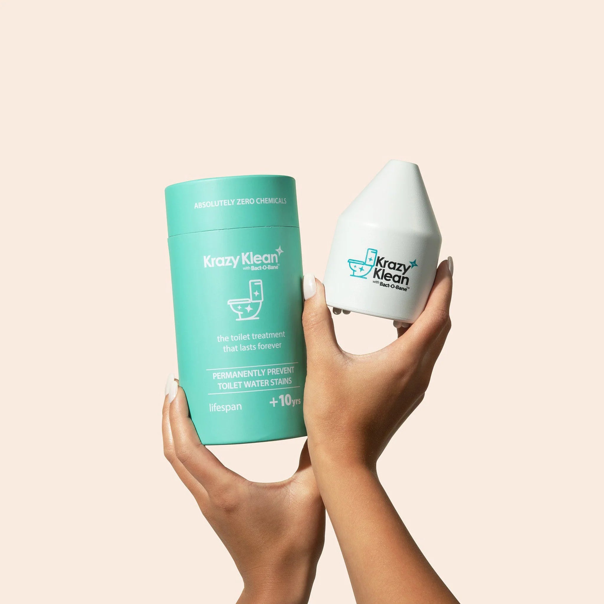 Hands holding the Krazy Klean toilet treatment product and its packaging.