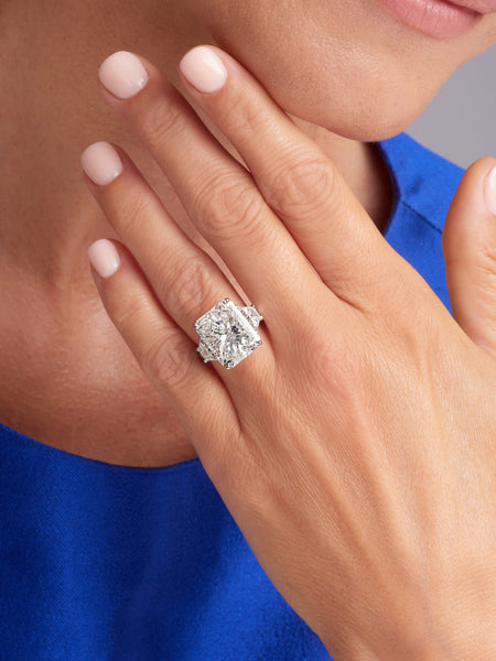 Large natural diamond engagement ring on woman's finger