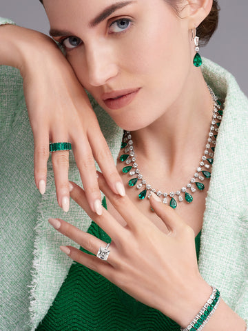 Woman wearing natural emerald jewelry