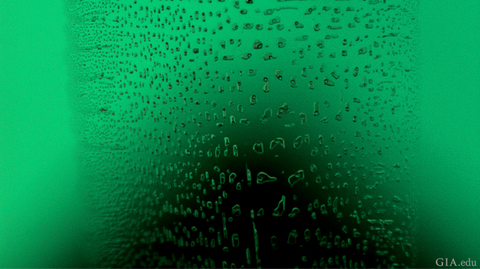 Flux droplets in a synthetic emerald