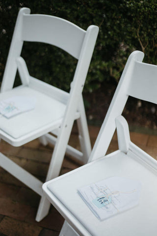 Handkerchief laying on chairs at wedding ceremony