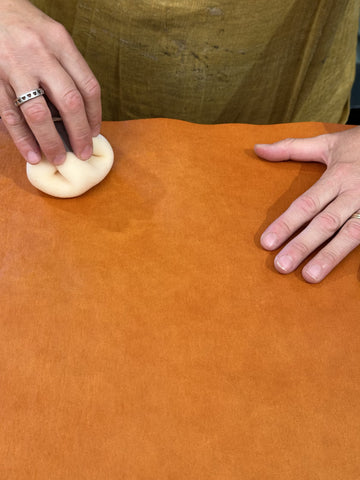 A sponge treatment is applied to a tan piece of Vacchetta paper