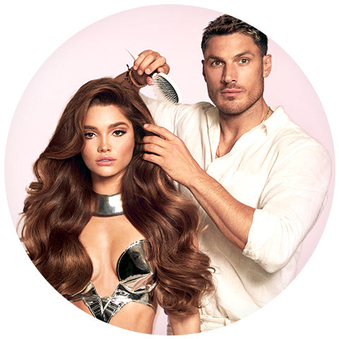 chris appleton with a model with voluminous brown hair