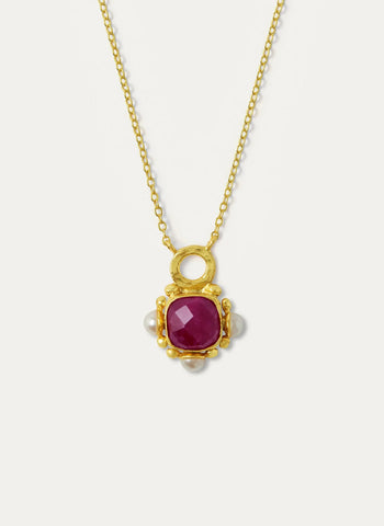 A celebration of colour and character, our pendant necklace oozes vintage charm. This handmade necklace features a captivating ruby gemstone set within a textured gold setting adorned by pearl beads for extra luxe factor.