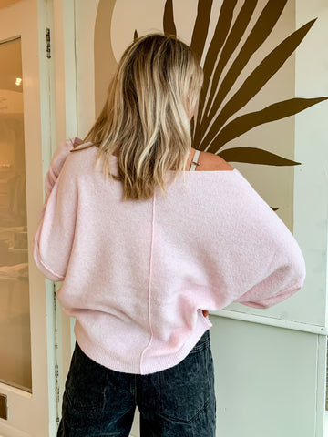 Nat wearing the Damsville sweater in sugared almond, from behind to show the slouchy fit.