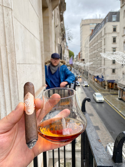 balcony meeting london with cigar and whiskey.jpg__PID:9db76f2c-6a16-40a9-8020-8de194995a68