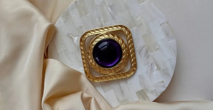 vintage brooch with purple gem