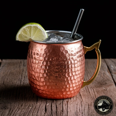  Moscow Mule cocktail in copper mug with lime wedge garnish