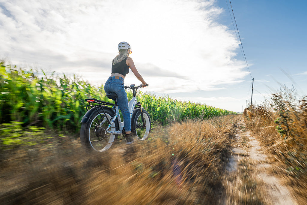 A woman rides an e-bike.-1130