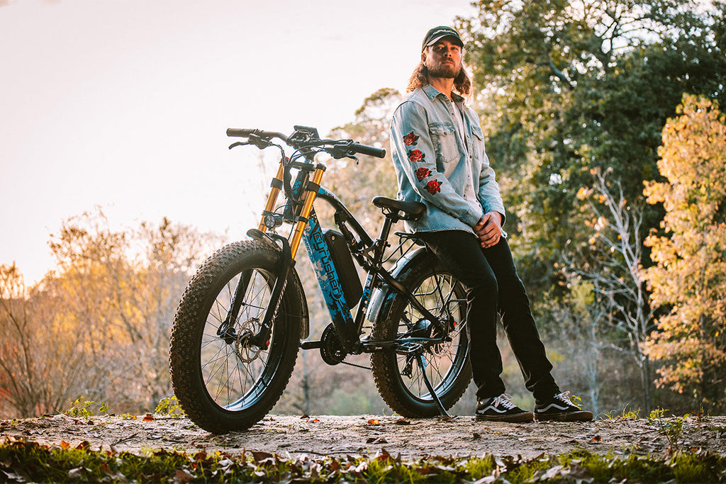 sunset, man and Cyrusher XF900 Electric fat-tire bike