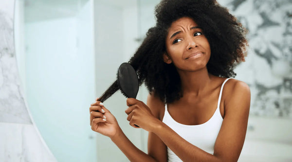 Woman Combing Hair