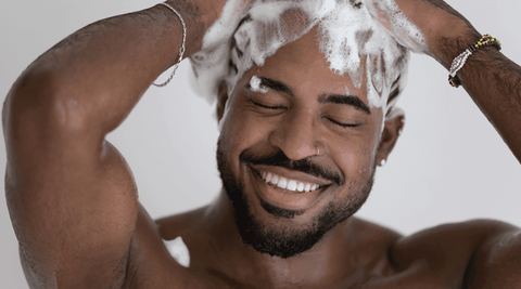 Black Man Washing His Hair for Dandruff