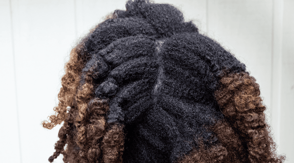 Black woman with natural curly hair.