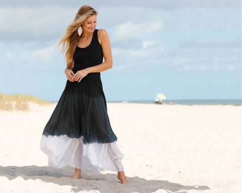 Woman in HAPARI Loungewear Collection Lucia Tank Dress in ombre on beach