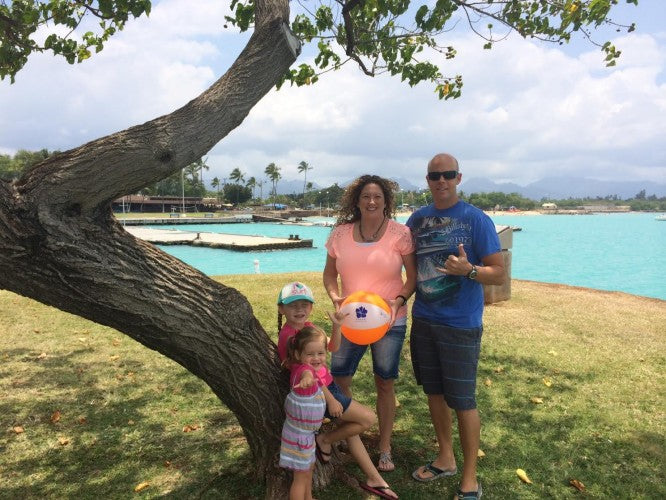 Hapari's Mother's Day staycation winner, with her husband and two girls and the winning Hapari Beach Ball