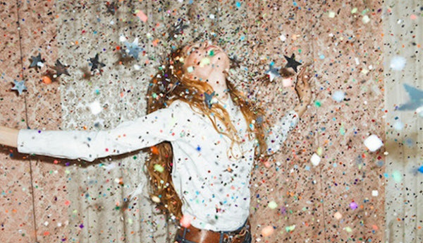 Glitter Falling on Top of a Woman Dancing 