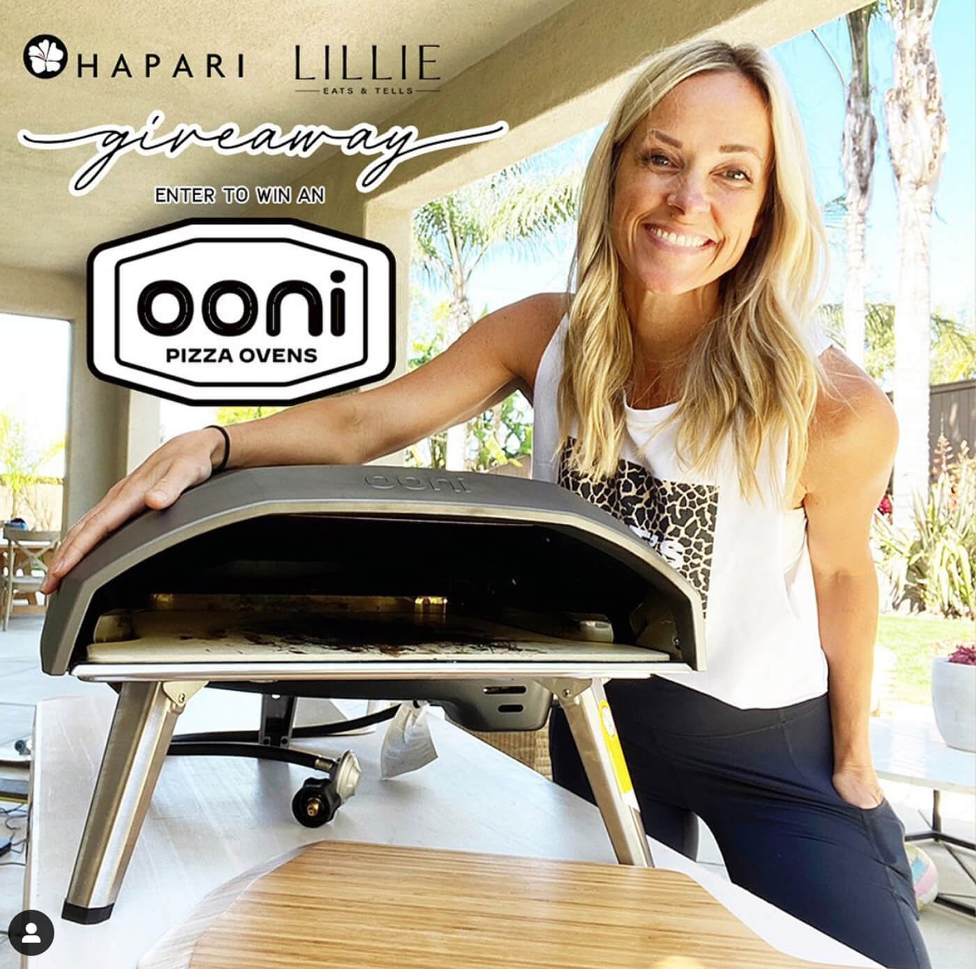 Woman Holding Onni Pizza Oven