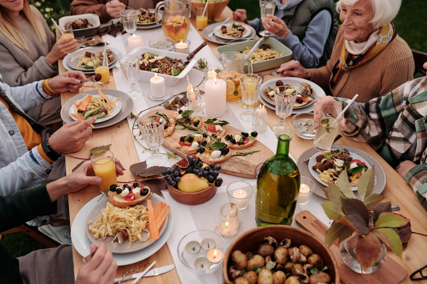 Family Eating at a Potluck Style BBQ