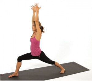 Woman Demonstrating  Warrior One Yoga Position 