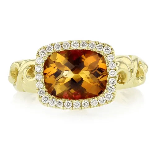 Yellow gemstone and diamond ring