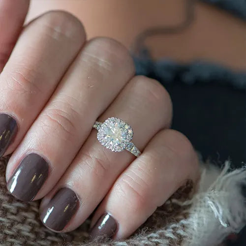 Diamond ring with dark nails