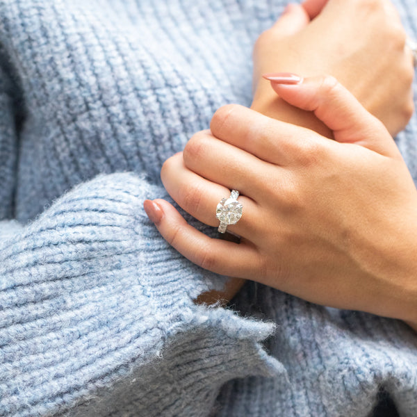 Diamond ring on blue sweater