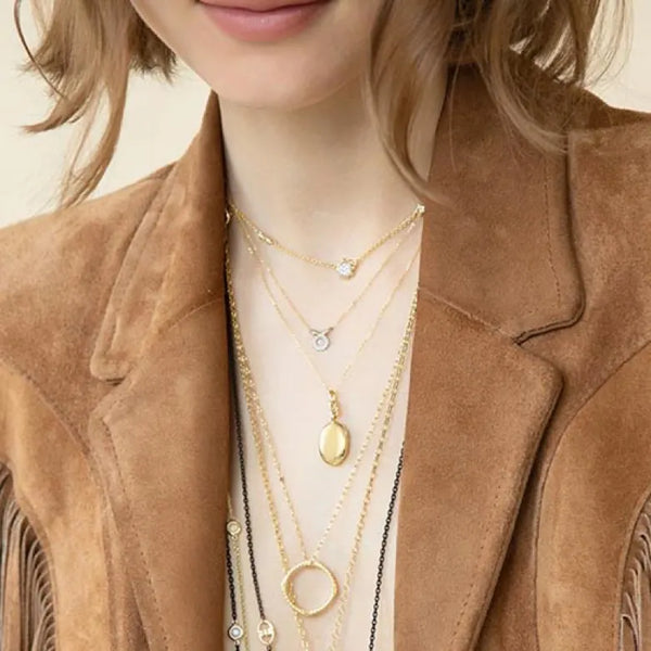 Layered gold necklaces