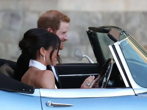 Meghan Markel wearing diamond ring in car with Harry