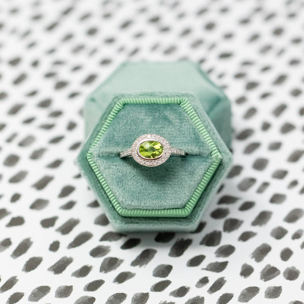 Green gemstone ring in green box