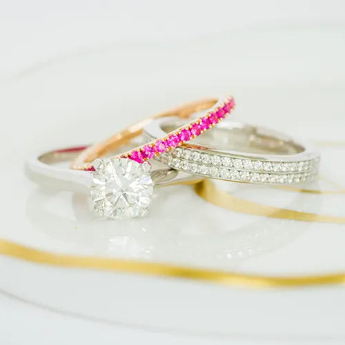 Pink diamond band and diamond rings