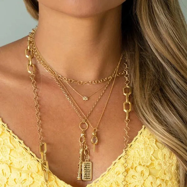 Gold necklaces layered