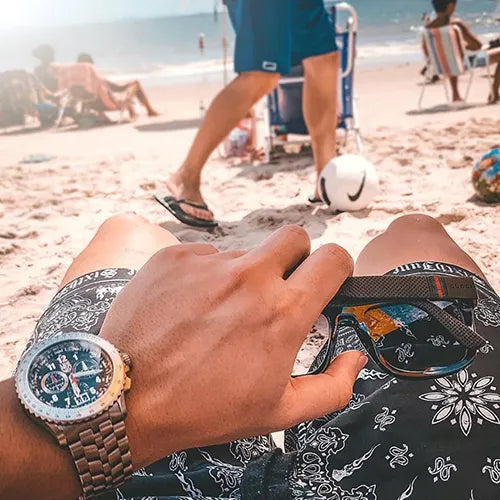 Mens luxury watch while on the beach