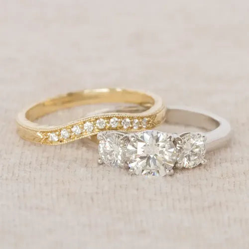 Halo diamond engagement ring and yellow gold rings