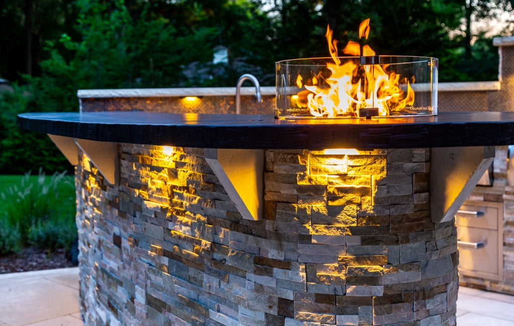 Cement and metal firepit in an outdoor setting. 