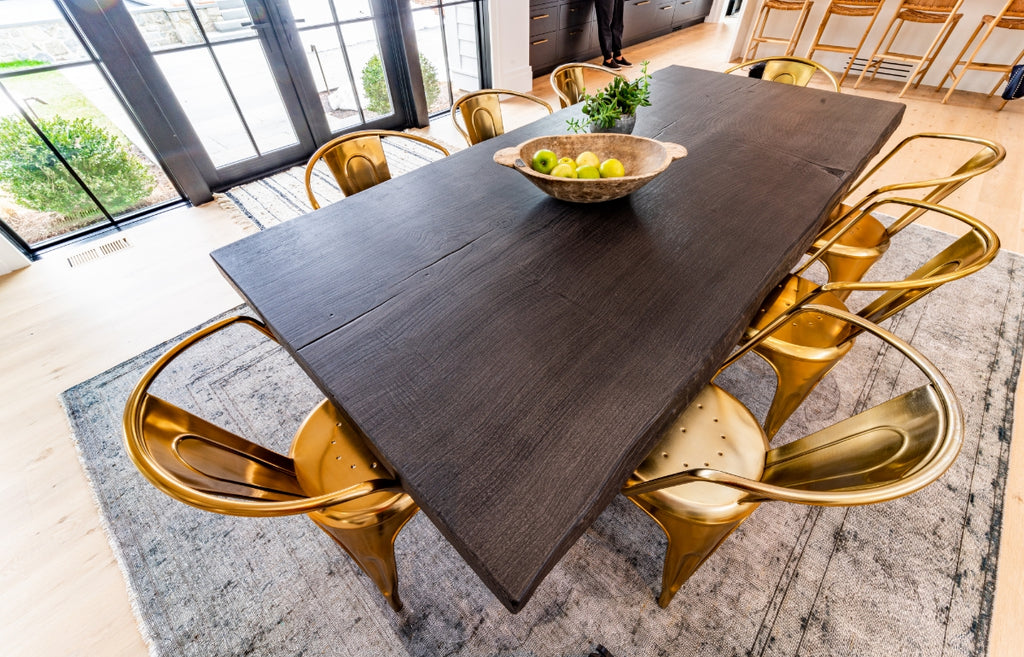 Walnut style dining table in Woodform concrete in a bright dining room.