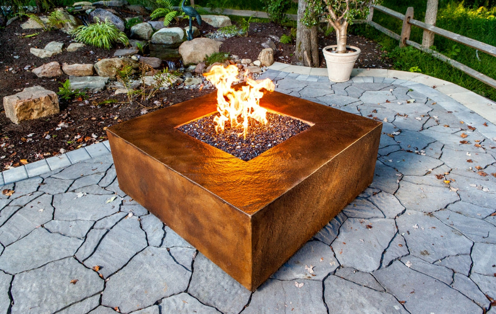 Stained concrete fire table on a patio.