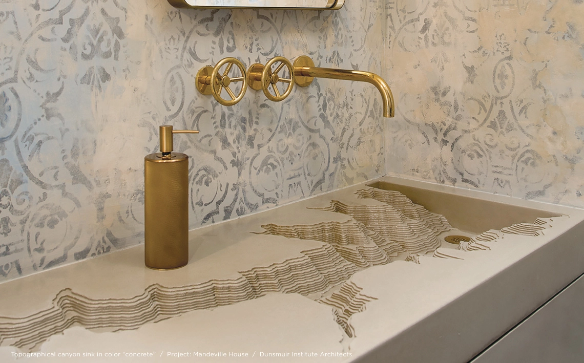 Large concrete sink with a basin shaped like a topo map of a canyon. 