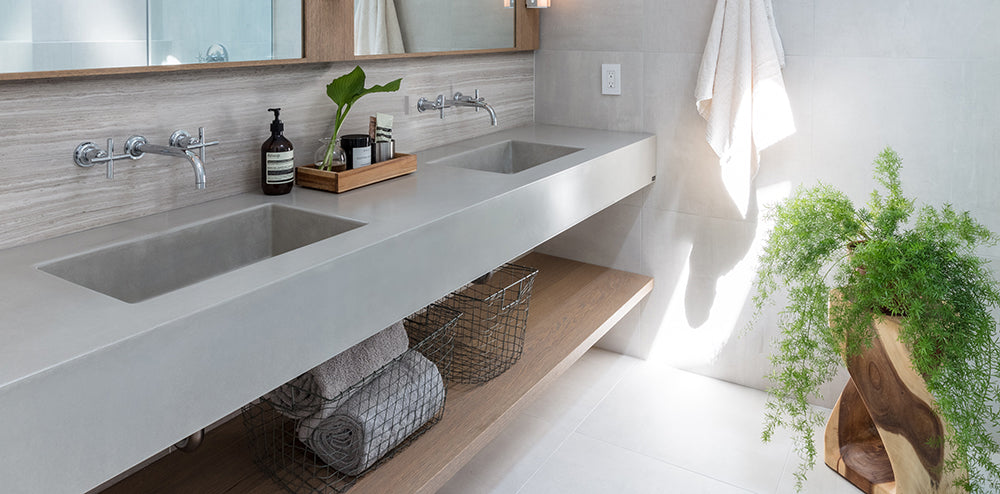 Airy bathroom with concrete sink and vanity.