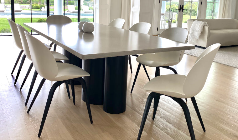 Concrete dining table in a modern style setting.