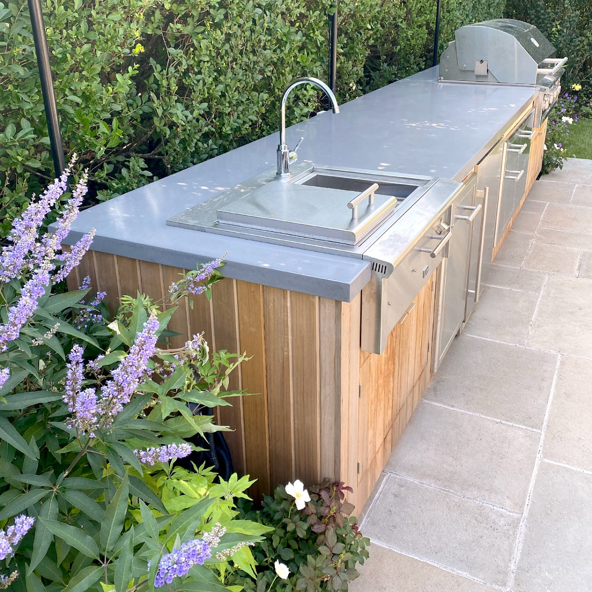 Outdoor kitchen with concrete countertops.