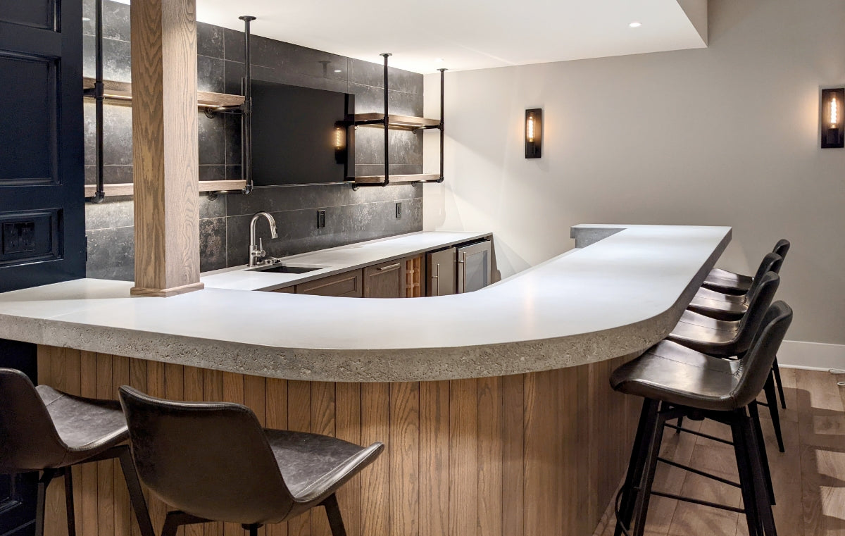 Custom kitchen with gray concrete bar top.