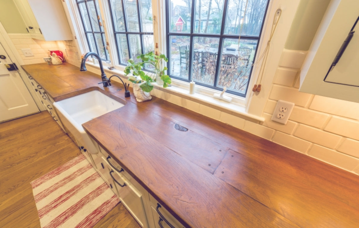 Cozy kitchen with wood look butcher block countertops.