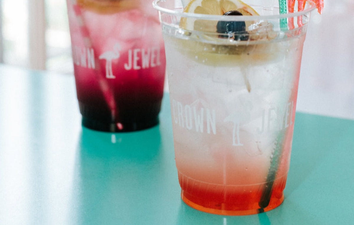 Teal countertops in a restaurant with drink on top.