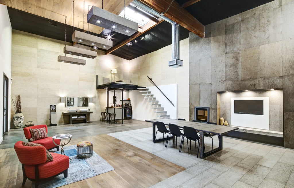 Open floor plan home in an industrial style with concrete wall panels.