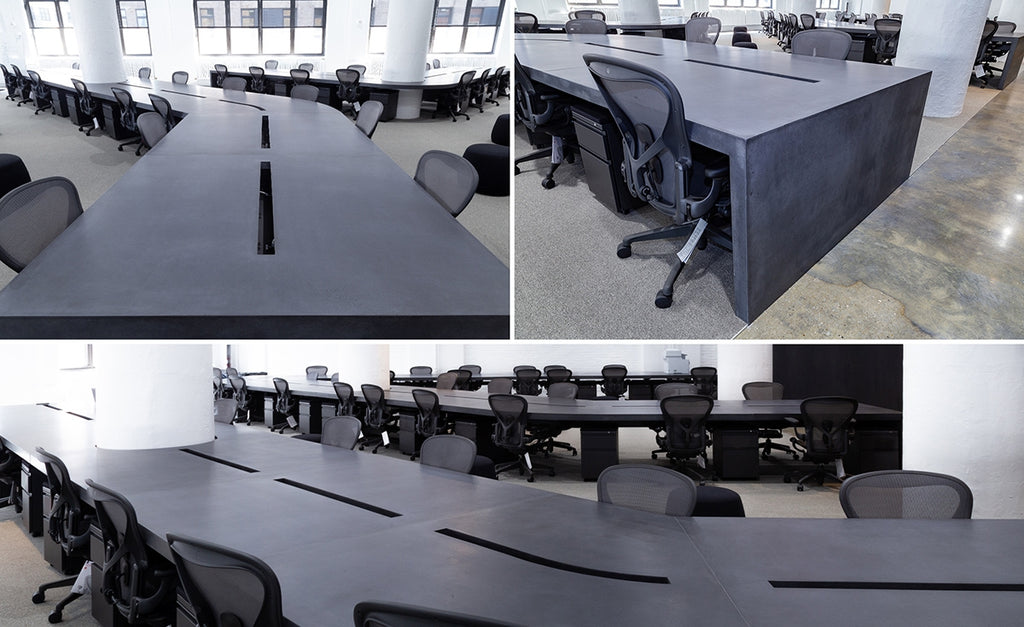 Custom concrete desks in black at the Squarespace headquarters.