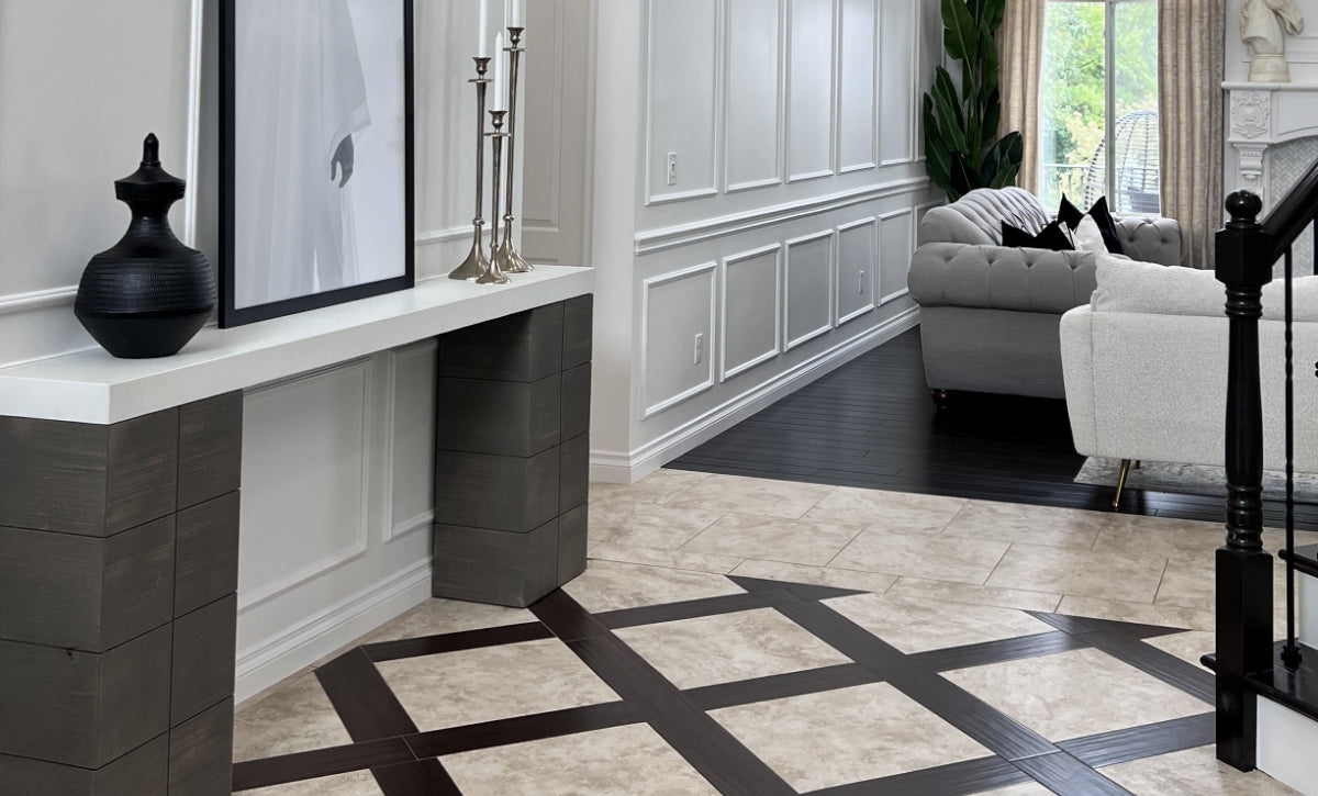 Dark wood console table with white concrete table top in a luxurious entryway.