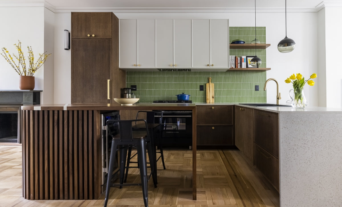 Kitchen with wood and concrete accents and green backsplash.