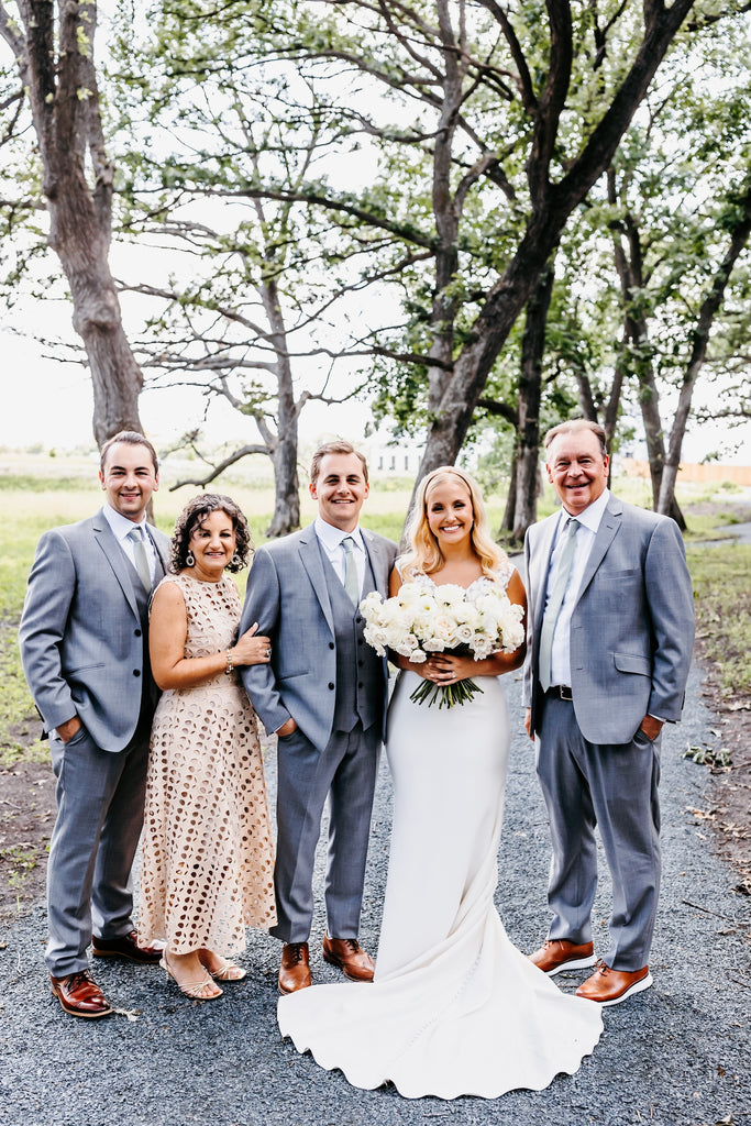 bride and groom with family