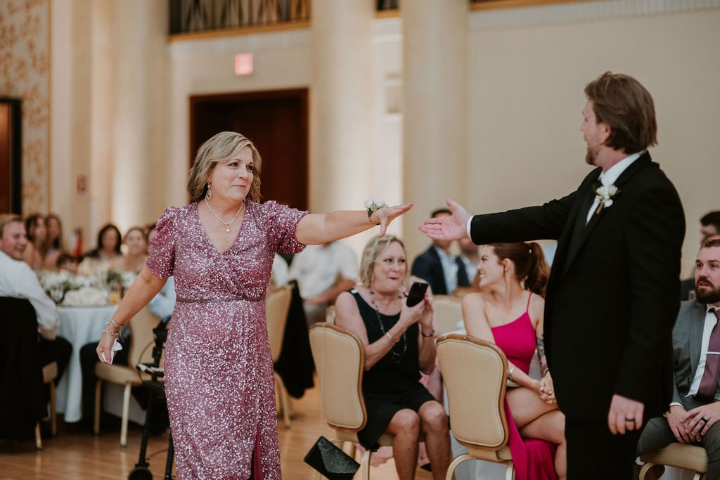 Mother of the groom and son dance