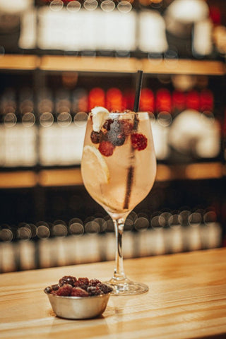 Non-alcoholic cocktail with fresh berries on a table